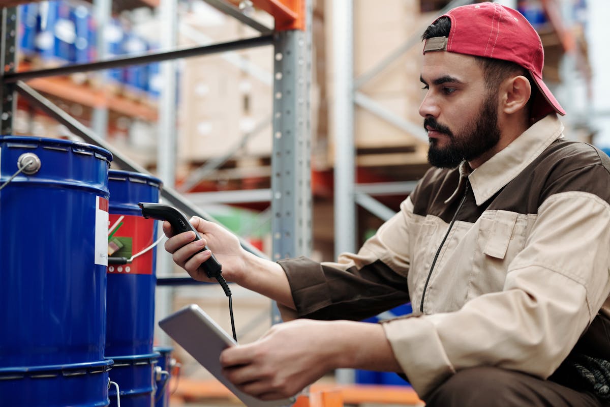 Warehouse worker scanning inventory with a barcode reader